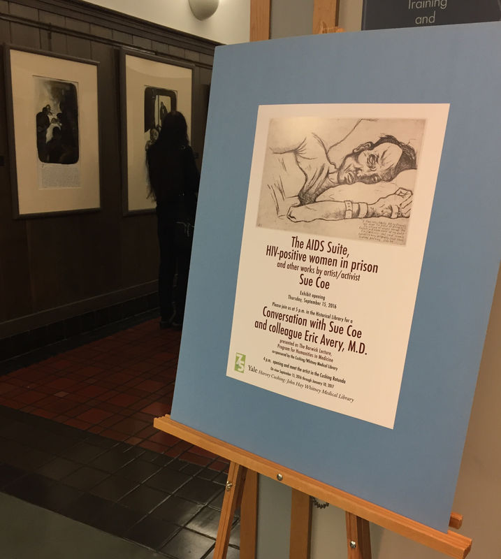 Photograph of an easel announcing an exhibition of Sue Coe's AIDS works recently acquired by Yale, 2016. A piece from Sue Coe's series, featuring "Anthony," an etching of a man laying down with his head on the pillow (piece is named