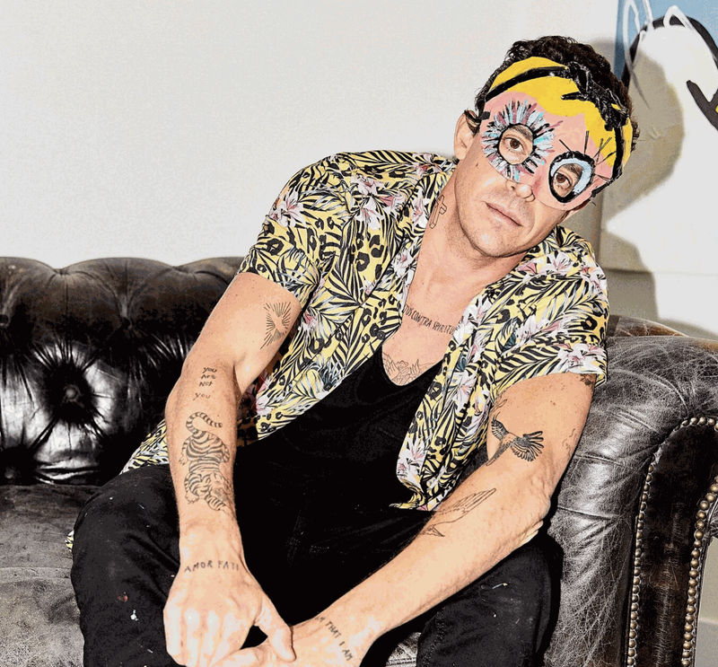 John Paul Fauves on a sofa