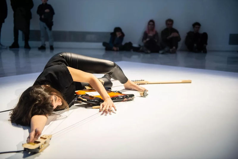Naama Tsabar, performance view of Melodies of Certain Damage (Opus 2), 2018, at Faena Art Center Buenos Aires, 2018. Composed and performed by Gabriela Areal, Rose Blanshei, Florencia Curci, Violeta García, Luciana Rizzo, Natalia Spiner, Sarah Strauss, Naama Tsabar,and Carola Zelaschi. Photo by Jorge Miño. © Faena Art Center.
