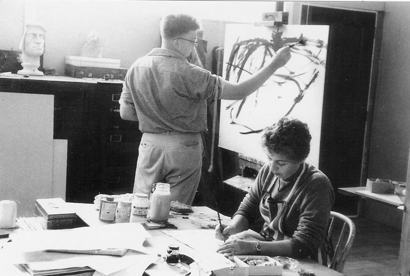 Artist James Juthstrom paints at a standing easel in a classroom at the Brooklyn Museum School of Art