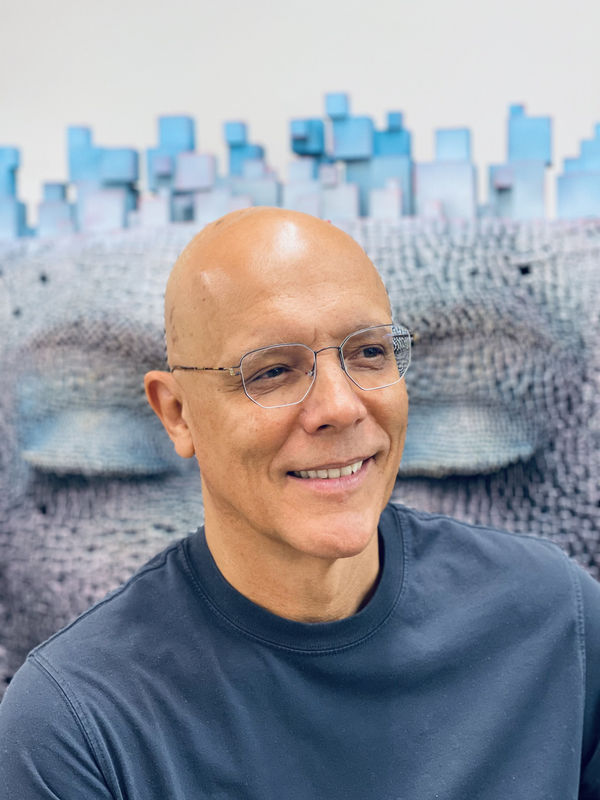 Gil Bruvel, visionary contemporary artist, crafts intricate sculptures and paintings blending fluidity, abstraction, and vibrant colors.