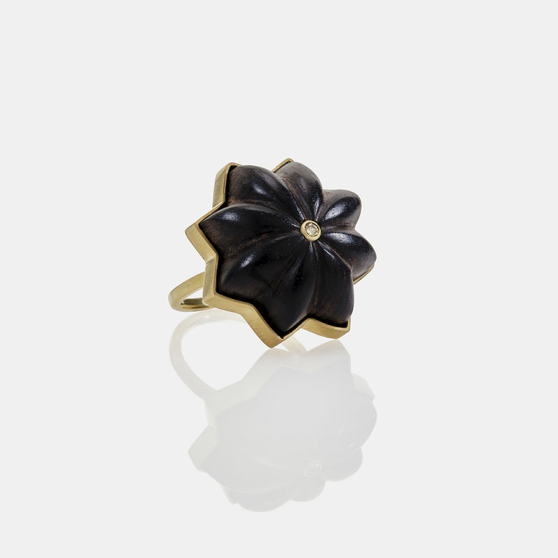 Tina Rath, “Carved Ring No. 4”, 2024. Hand-carved African blackwood, 18K gold, and green diamond.