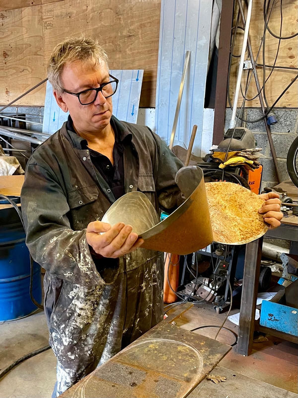 Sculptor Simon Bacon in his studio