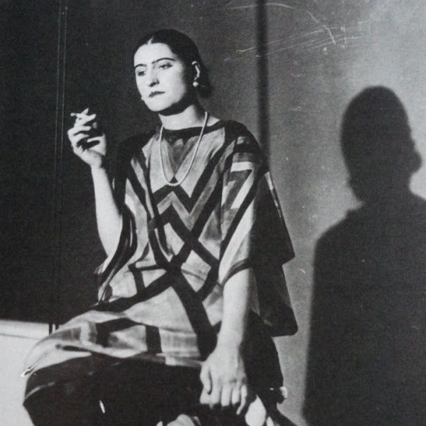 Sonia Delaunay, a pioneering artist known for vibrant colors and geometric shapes, blurred the lines between painting, fashion, and design.