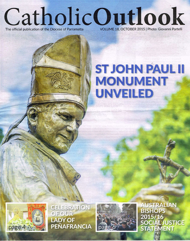 Cover of the Catholic Outlook magazine, Volume 18, October 2015, featuring a photograph of the bronze monument of St. John Paul II created by sculptor Linda Klarfeld. The statue depicts the late Pope wearing a mitre adorned with intricate designs, holding