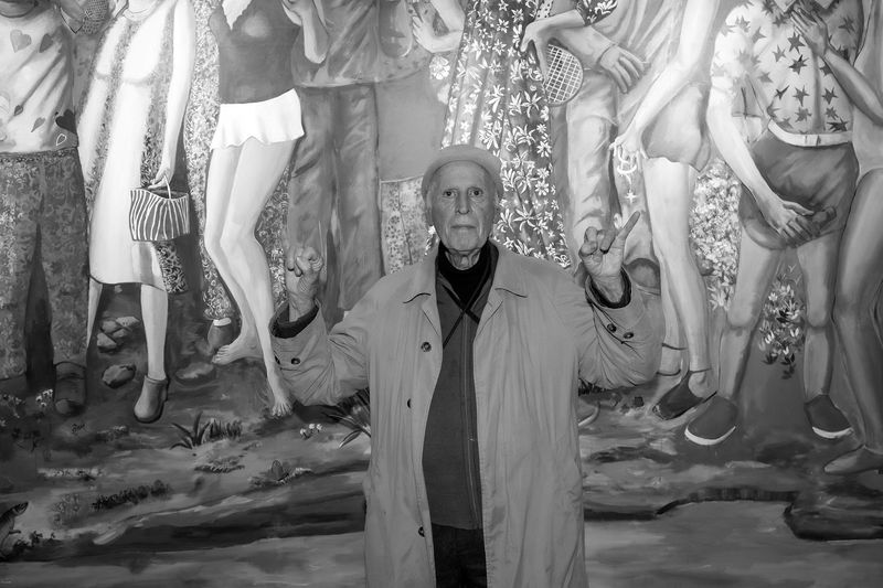 PARIS, FRANCE - OCTOBER 22: Artist Martial Raysse poses in front of his work on the Daniel Templon booth during the opening of Art Basel Paris 2025 on October 22, 2025 in Paris, France. (Photo by Luc Castel/Getty Images) Moins