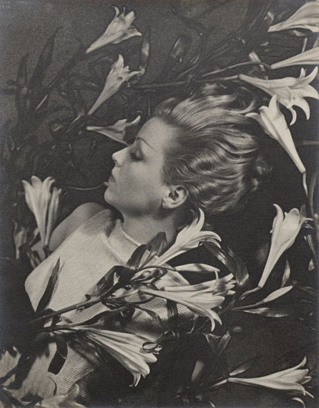 profile of woman with background of flowers