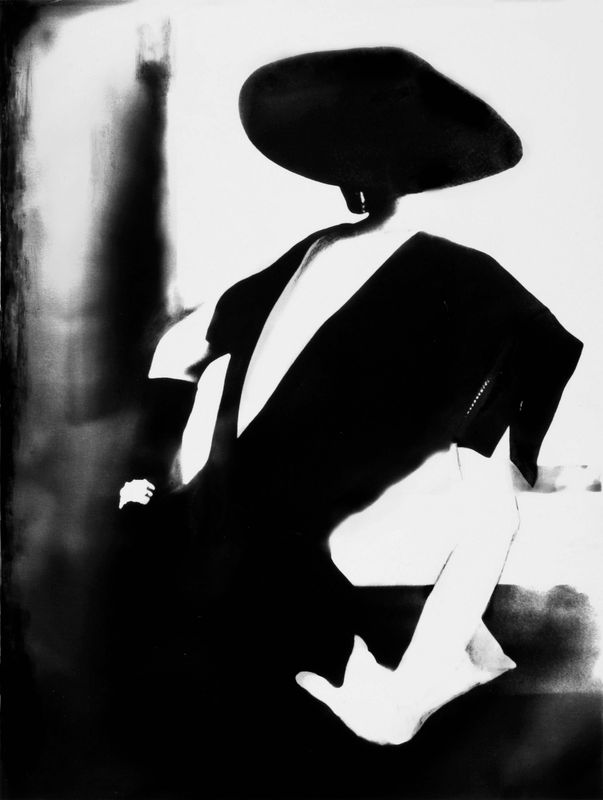 black and white image of Barbara Mullen wearing a black Dior dress and one white glove by Lillian Bassman