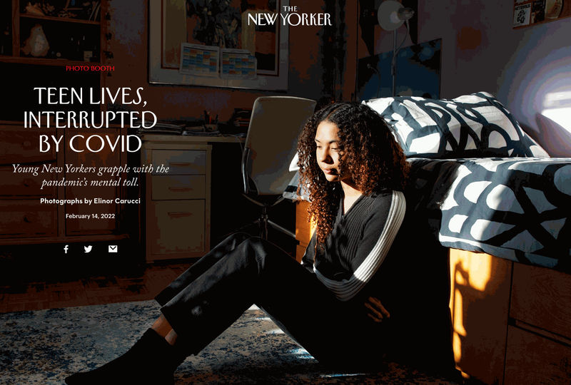 A girl on the floor of her bedroom in New York City