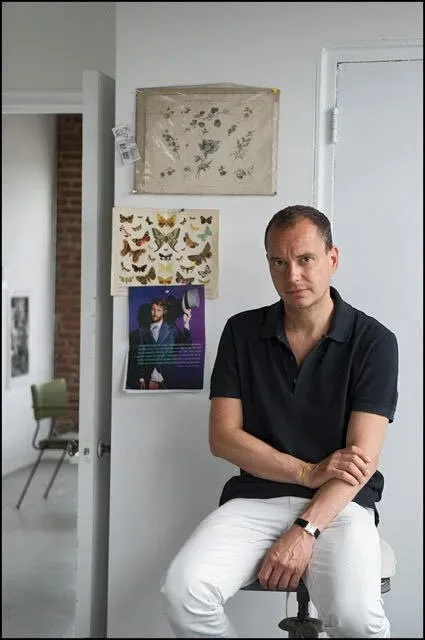 Portrait of Sebastiaan Bremer sitting on stool