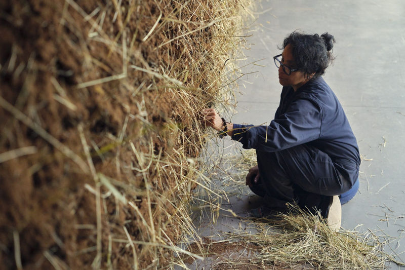 Delcy Morelos installing El abrazo (The Embrace), 2023, at Dia Chelsea, New York.