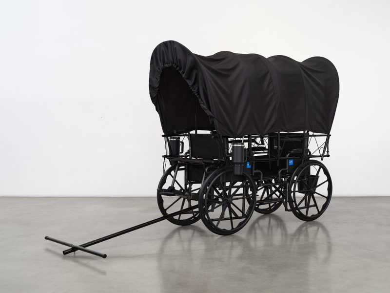 Josh Callaghan, "Covered Wagon", 2026, wheelchairs, powder coated steel, nylon, paracord, thermal cups, hatchet, shovel, bucket, 66 x 40 x 106 in (167.6 x 101.6 x 269.2 cm)
