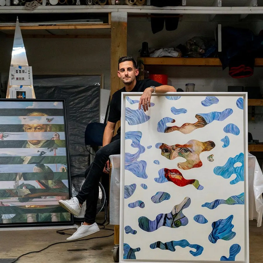 Dan Alva in the studio with original paintings