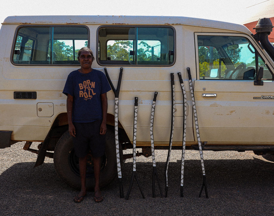 Carissa Gurwalwal with her carved and painted mimih spirits. Image courtesy of Marrawuddi Art Centre.
