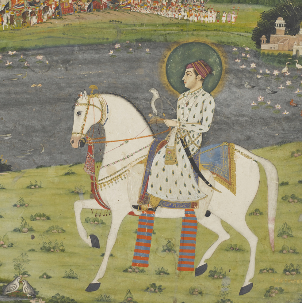 A young prince dressed in a long white jama patterned with green leaves outlined in gold is riding past a lake filled with lotuses and ducks.